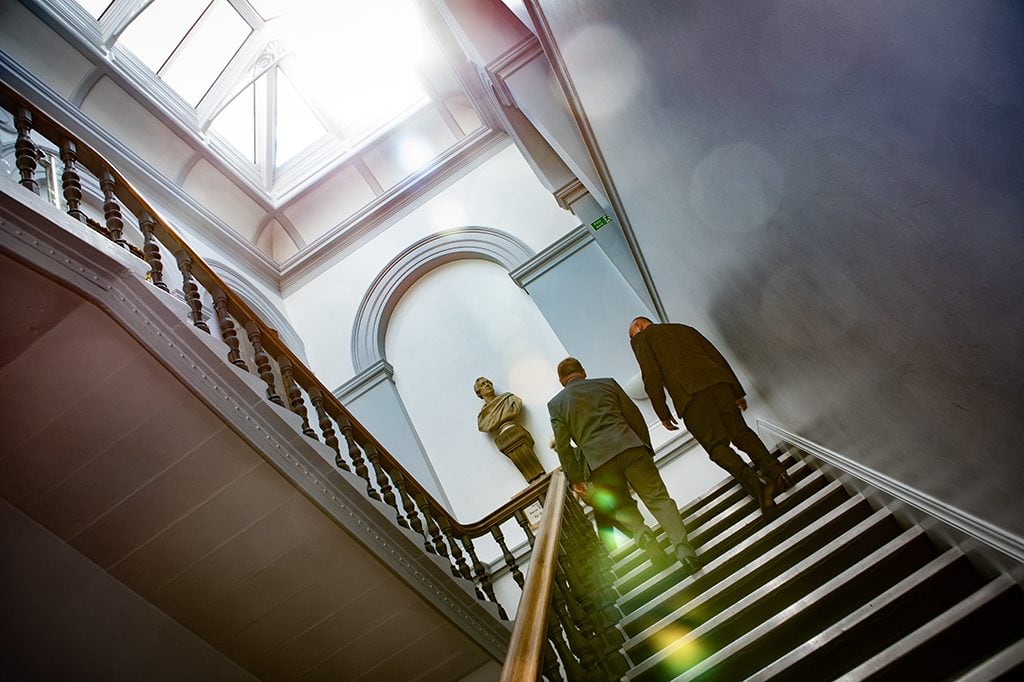 Groom & Bestman scaling Morpeth Town Halls Staircase