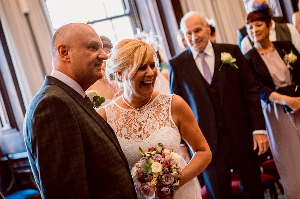 Bride & Groom laughing during service at Morpeth Town Hall