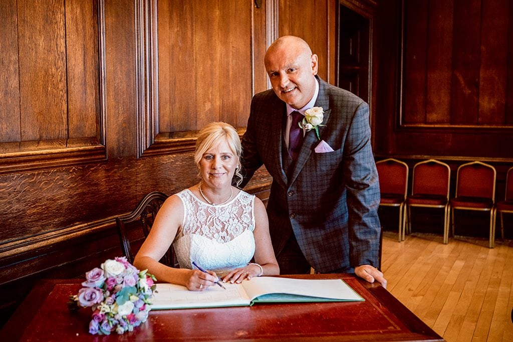 Bride & Groom signing register in the Ballroom, Morpeth Town Hall