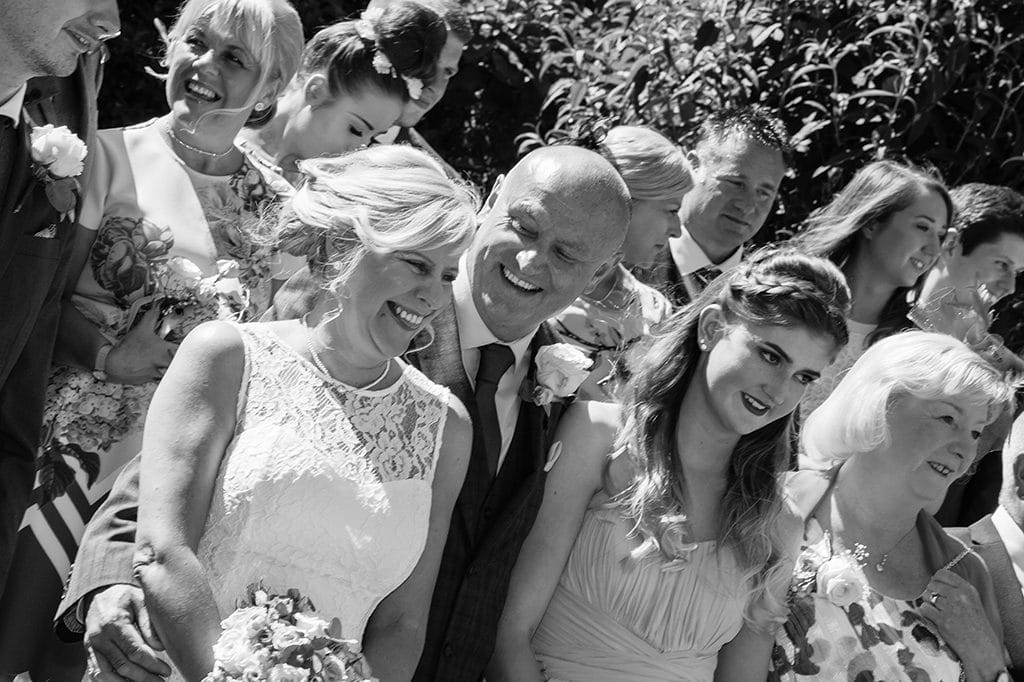 Bride & Groom Laughing in Wedding Group, Carlisle Park, Morpeth