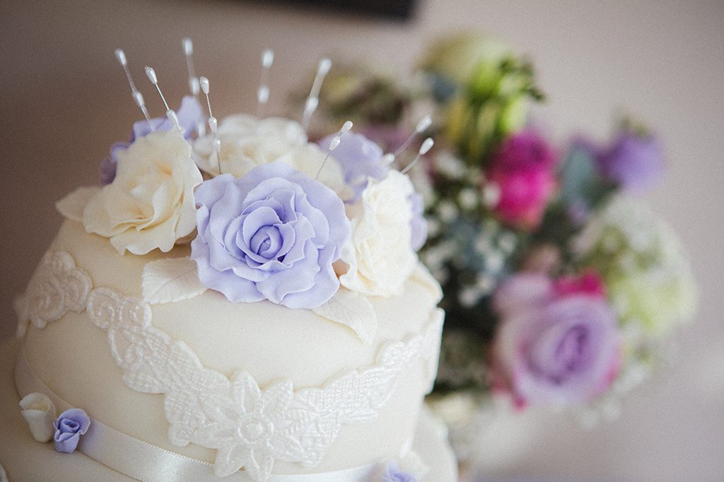 Close up of wedding cake & flowers, Funtion Room, The Waterford Lodge in Morpth