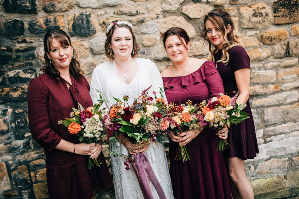 Bride & Bridesmaids holding their Bouquets from Northumbrian Flowers