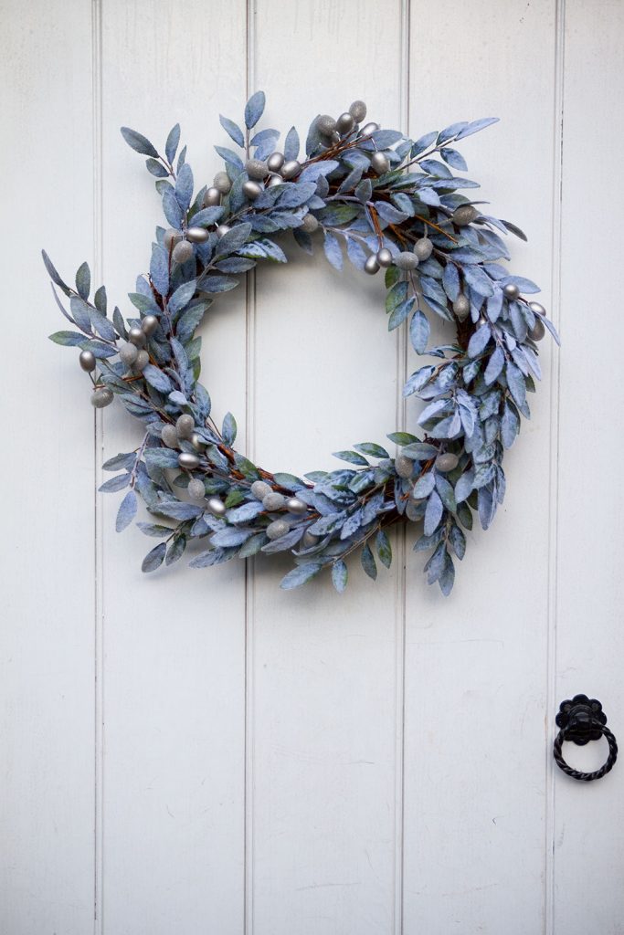Blue & Silver Wreath hanging on white door at Brinkburn Priory