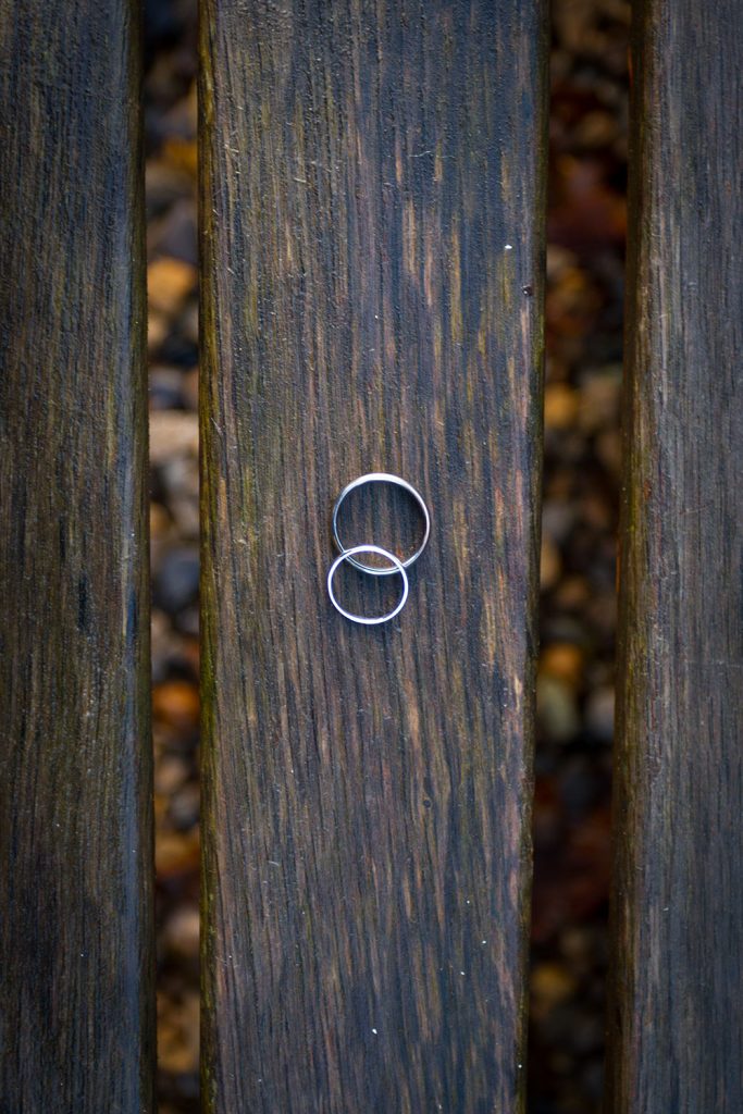 Wedding rings on a bench at Brinkburn Priory