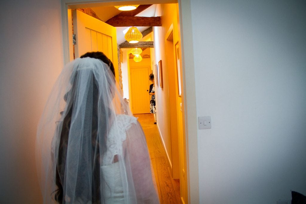 Brides mum getting a sneak peek down a corridor 