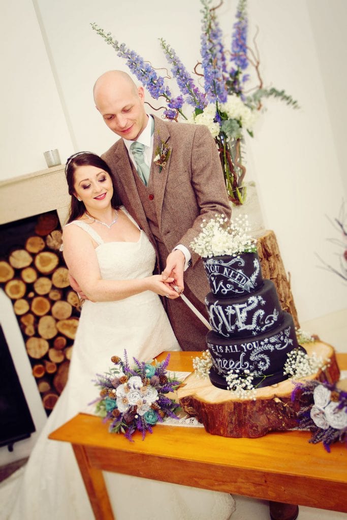 Bride & Groom Cutting Wedding Cake