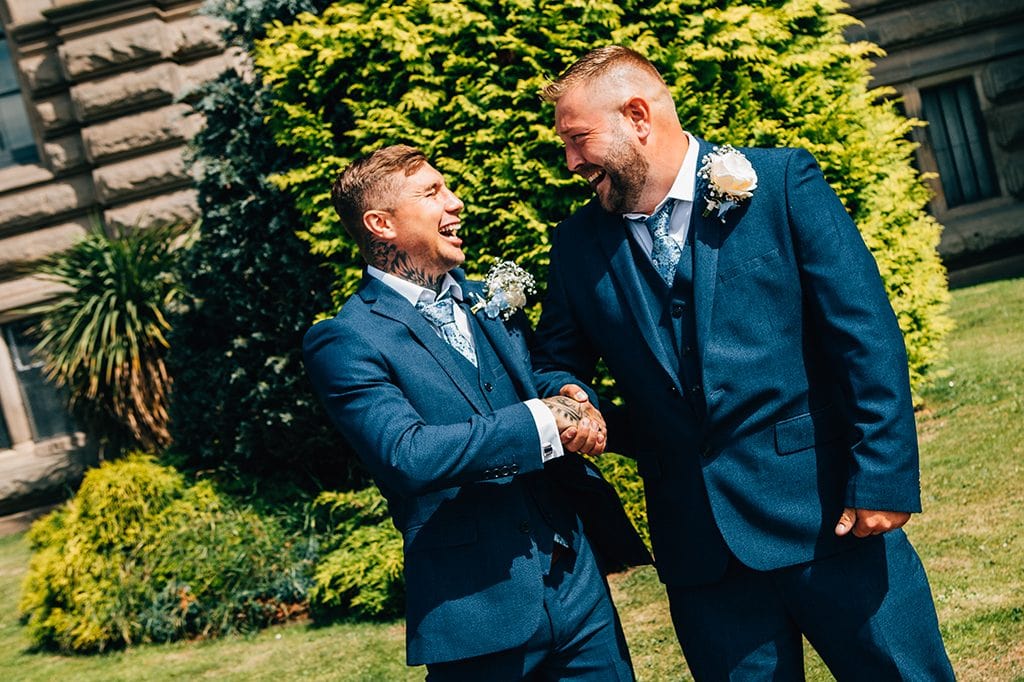 Groom & Bestman, shaking hands, in front of South Shields Town Hall
