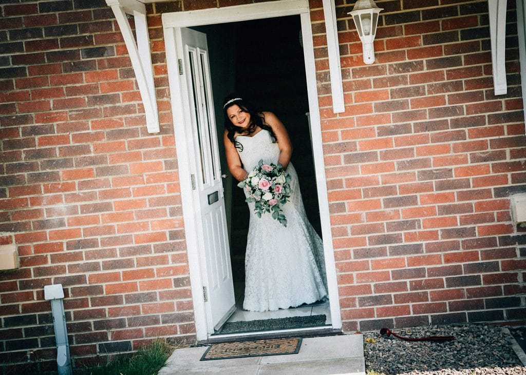Bride watching from her front door