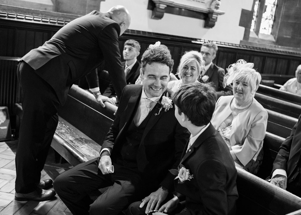 Groom chatting to his son at St. Cuthberts Church in Blyth