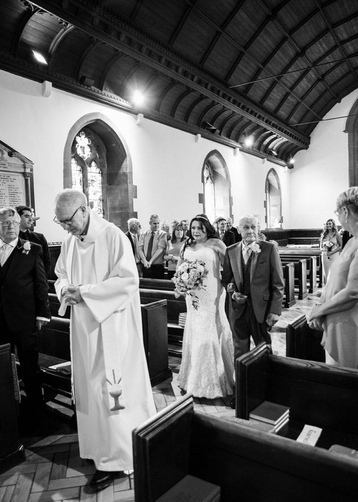 Bride walking down aisle in St. Cuthberts in Blyth, Northumberland