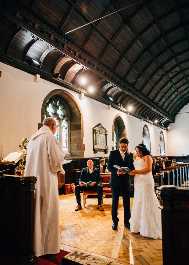 Bride & Groom sing hymns in St. Cuthberts in Blyth, Northumberland