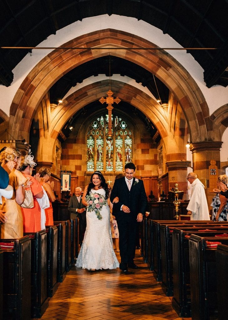 Bride & Groom walking down the aisle of St Cuthberts Church in Blyth