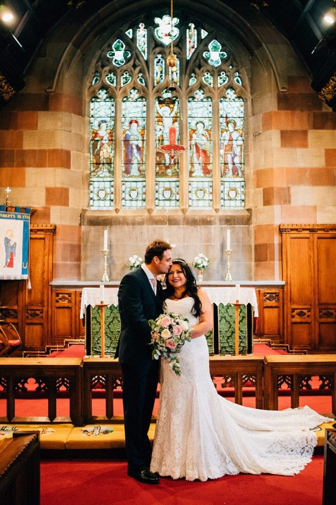 Bride & groom on the alter of St Cuthberts Church in Blyth