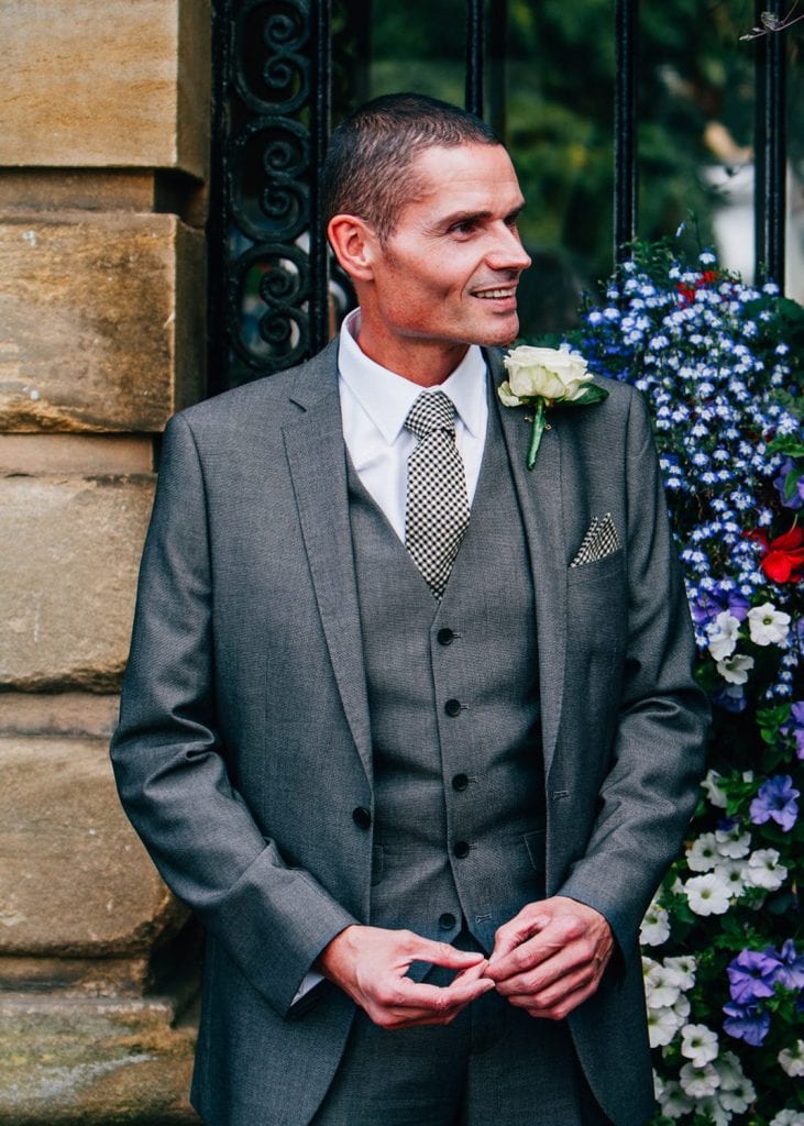 Groom nervously waiting outside Morpeth Town Hall in Northumberland