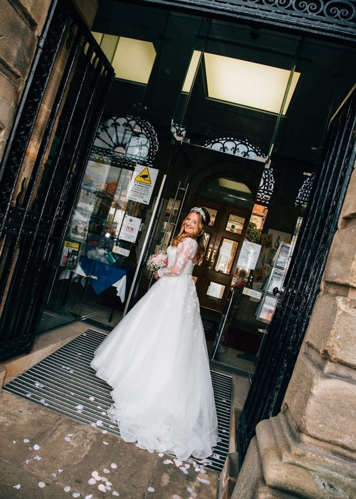 The bride outside of Morpeth Town Hall in Northumberland
