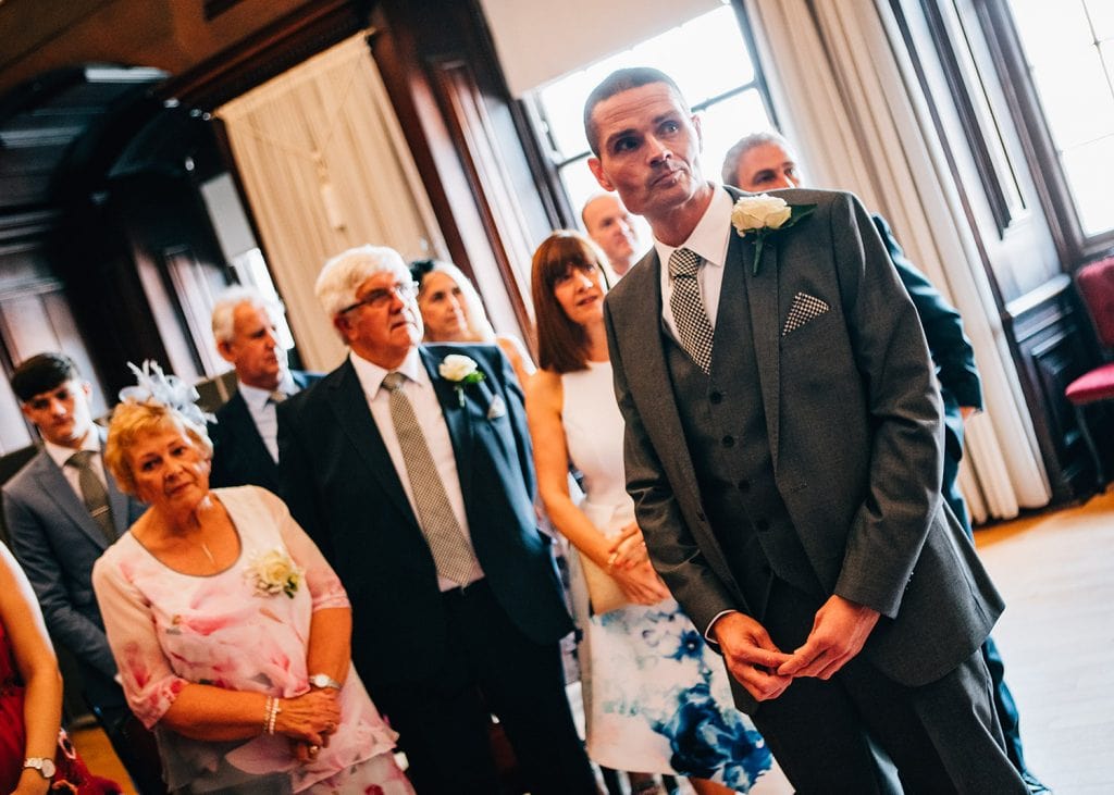 The groom waiting nervously in the Ballroom, Morpeth Town Hall in Northumberland