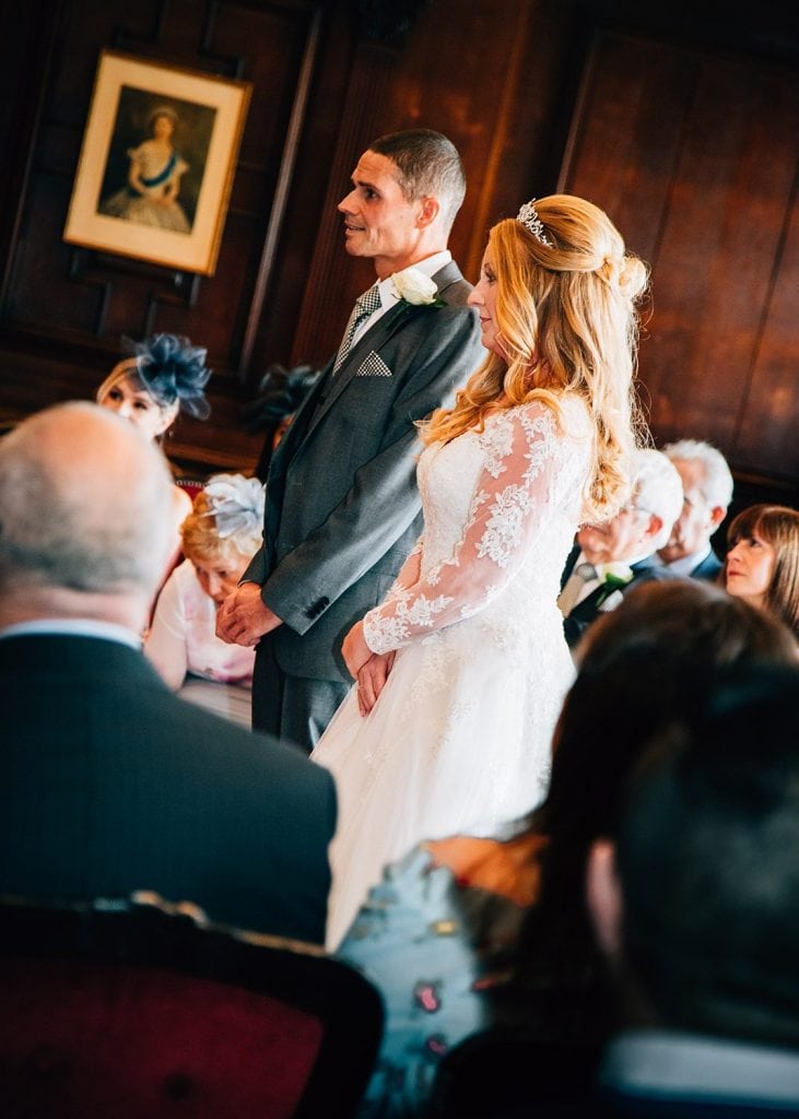 Bride & Groom listerning to the registrar in the Ballroom, Morpeth Town Hall in Northumberland