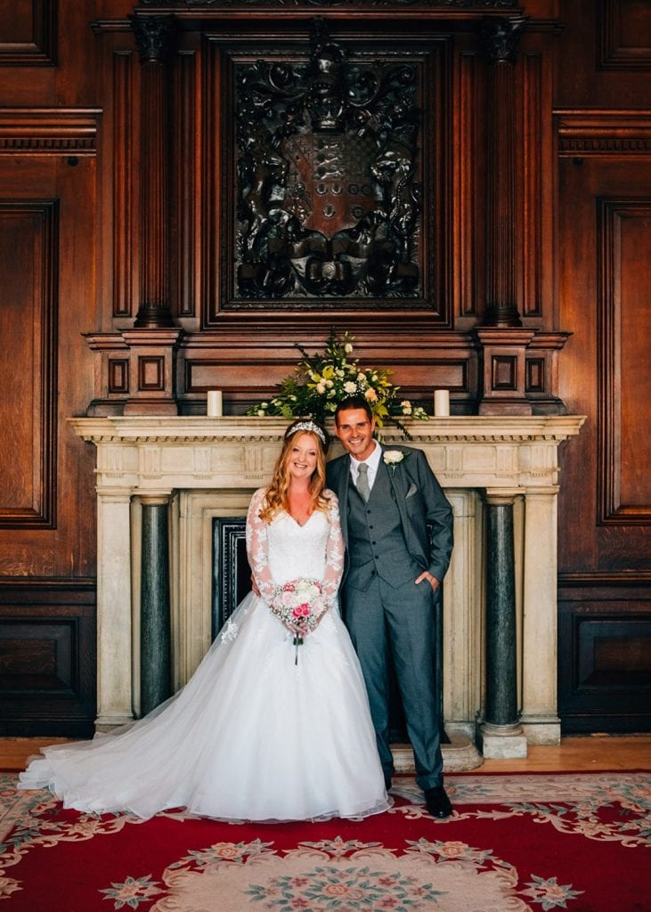The bride & groom in front of the Ballroom fireplace in Morpeth Town Hall, Northumberland