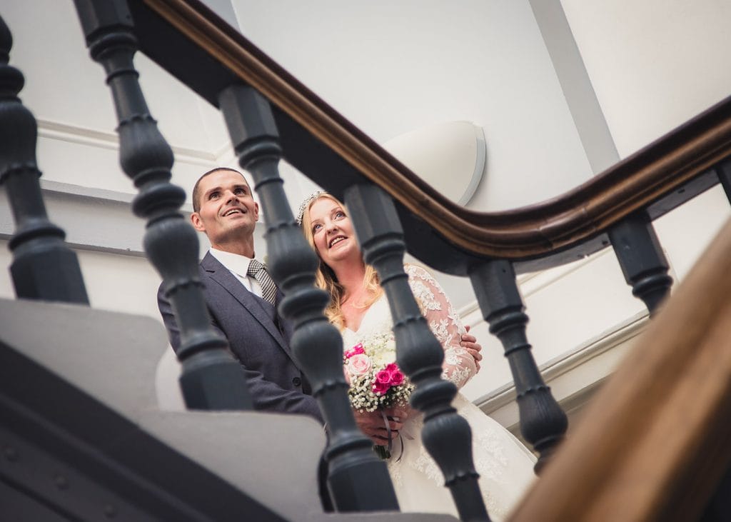 The bride & groom in staircase of Morpeth Town Hall, Morpeth