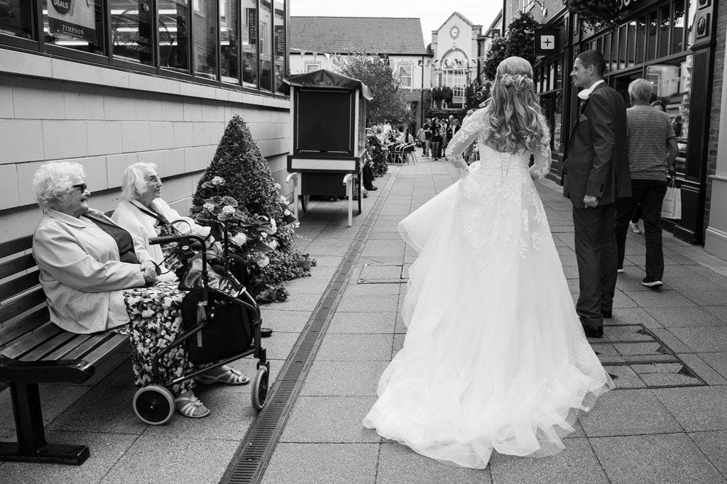The bride and groom Walking through Sanderson Arcade in Morpeth