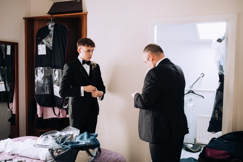 Groom and his son getting ready at Horton Grange Hotel in Northumberland