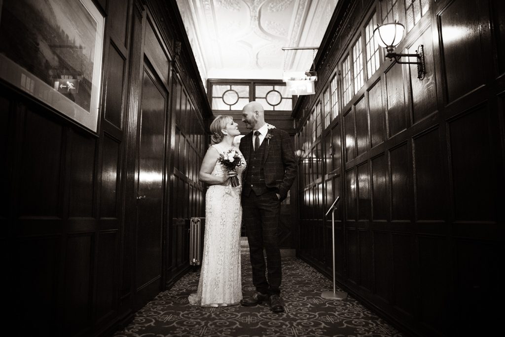 The bride & groom waiting tin a corridor at The Mansion House in Jesmond, Newcastle