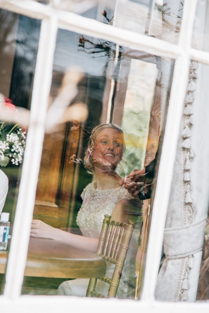 Bride through a window