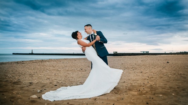 Groom dancing with Bride on Sunderland Beach Front