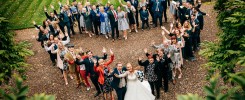 Bride & Groom with all of their guests in a heart shape group at Eshott Hall, Northumberland